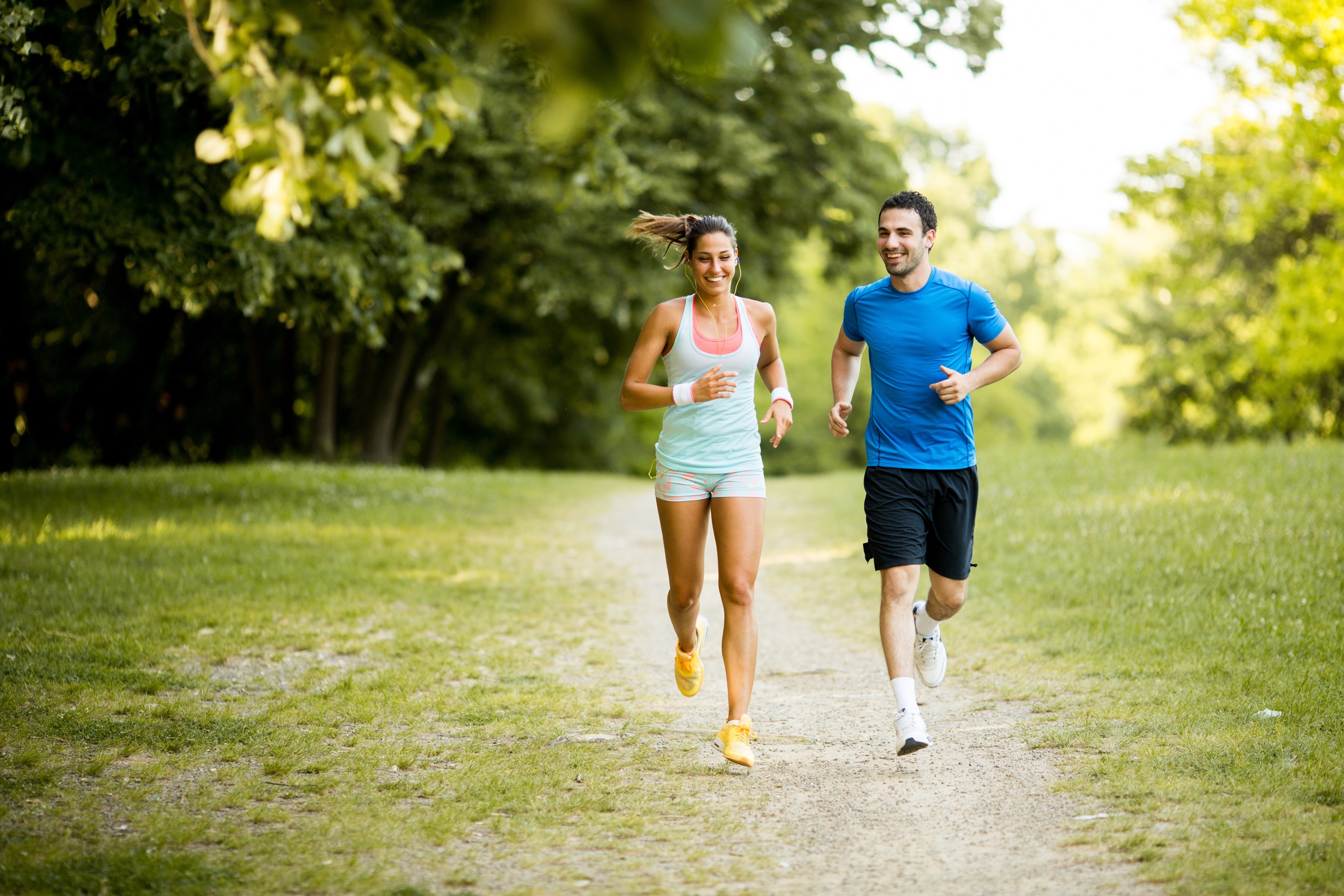 Young couple running Young couple jogging outside
